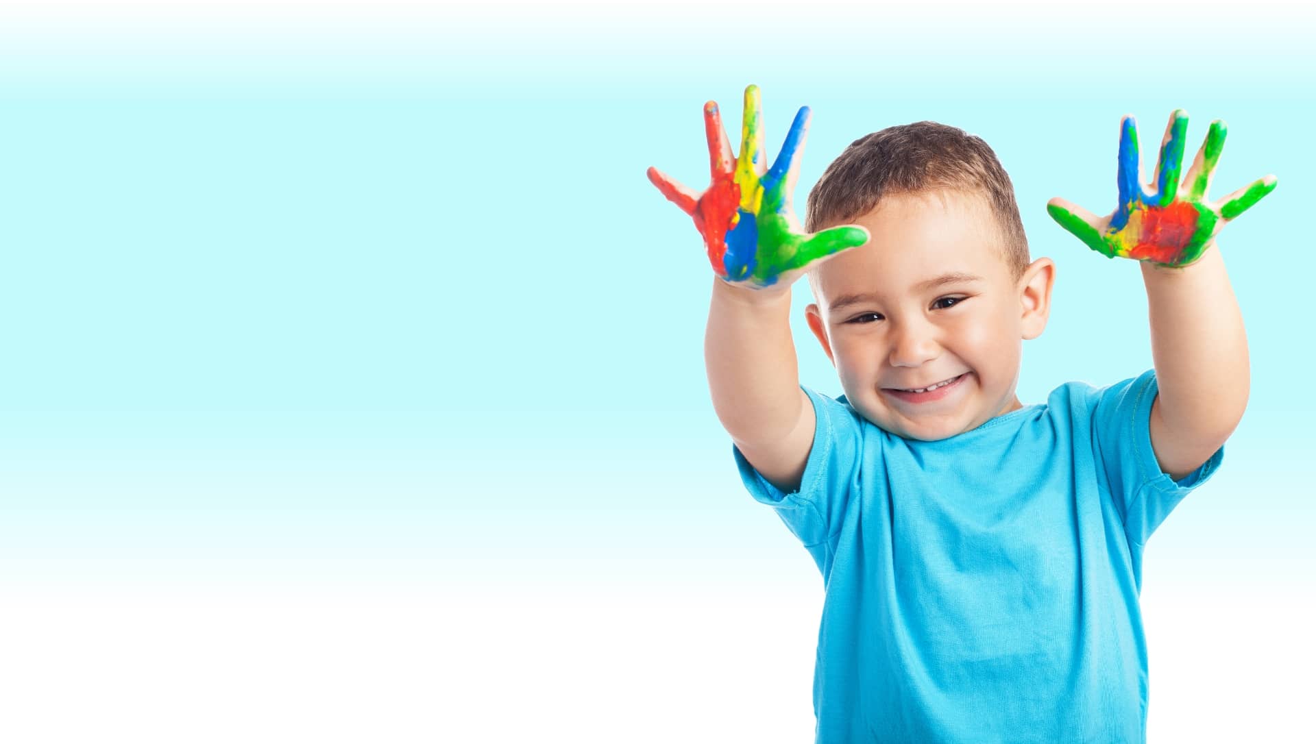 Smiling child with painted hands