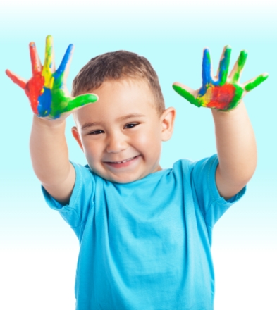 Smiling child with painted hands